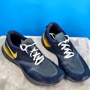 Nike black and gold Odyssey 11 flawed